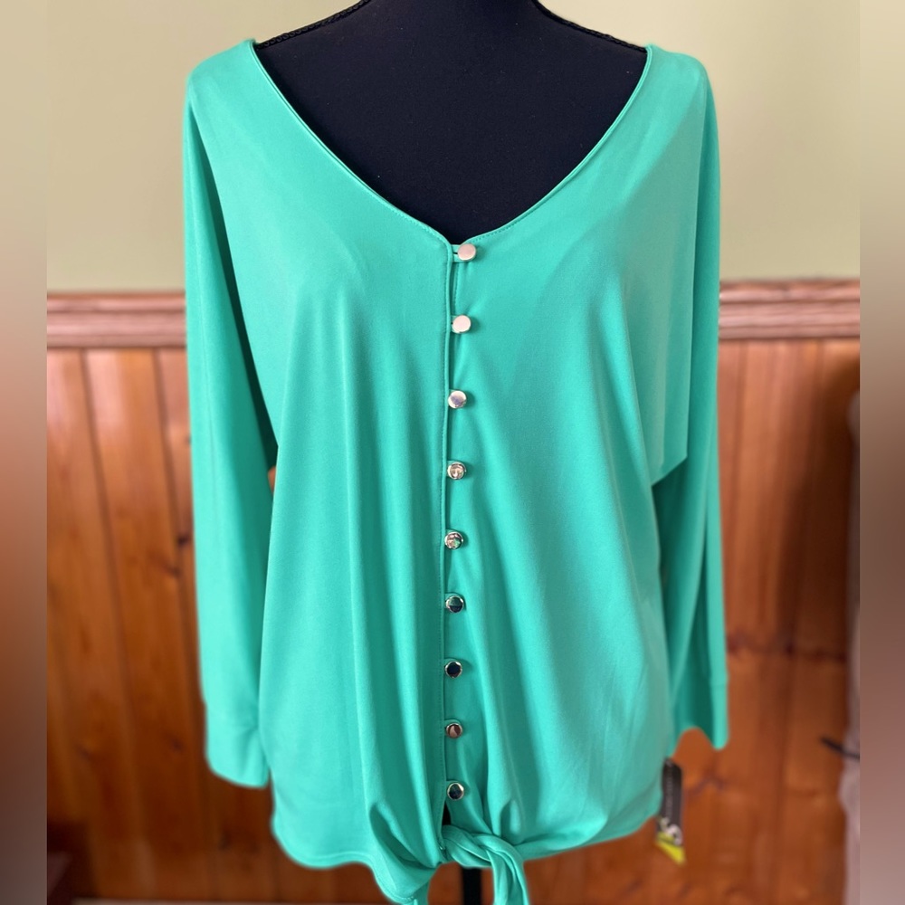 Women’s size large very pretty top.  New!